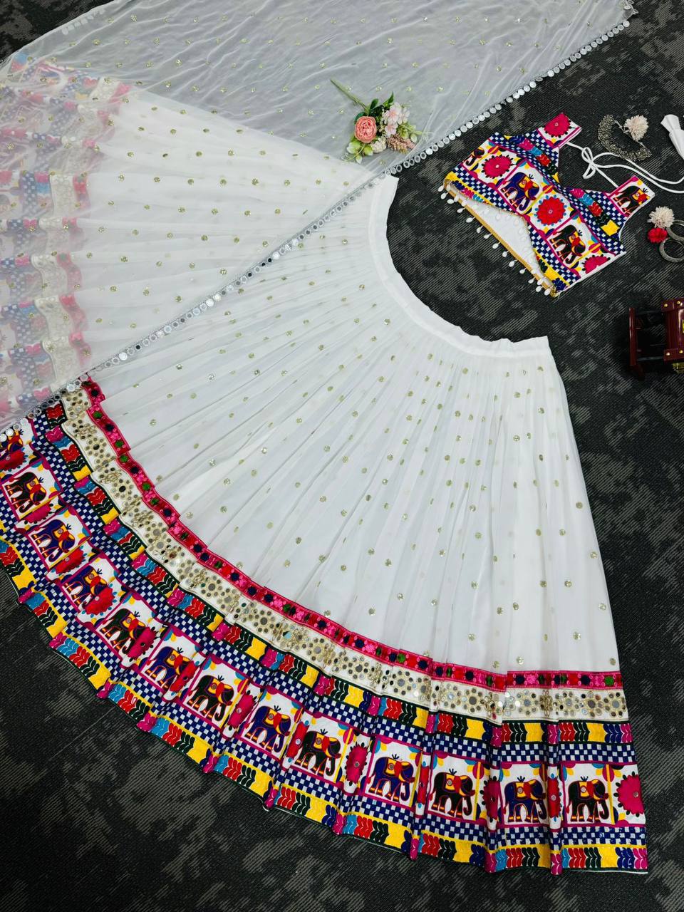 Exquisite Pristine White Designer Lehenga Choli with Vibrant Multicolored Traditional Elephant Embroidery and Mirror Work Detailing